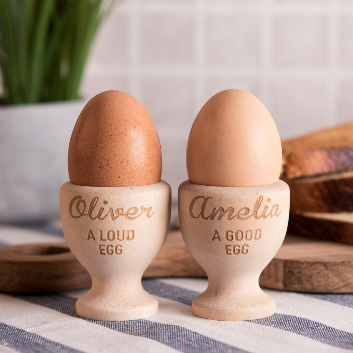 Personalised Set Of 2 Wooden Egg Cups - Good Egg, Loud Egg