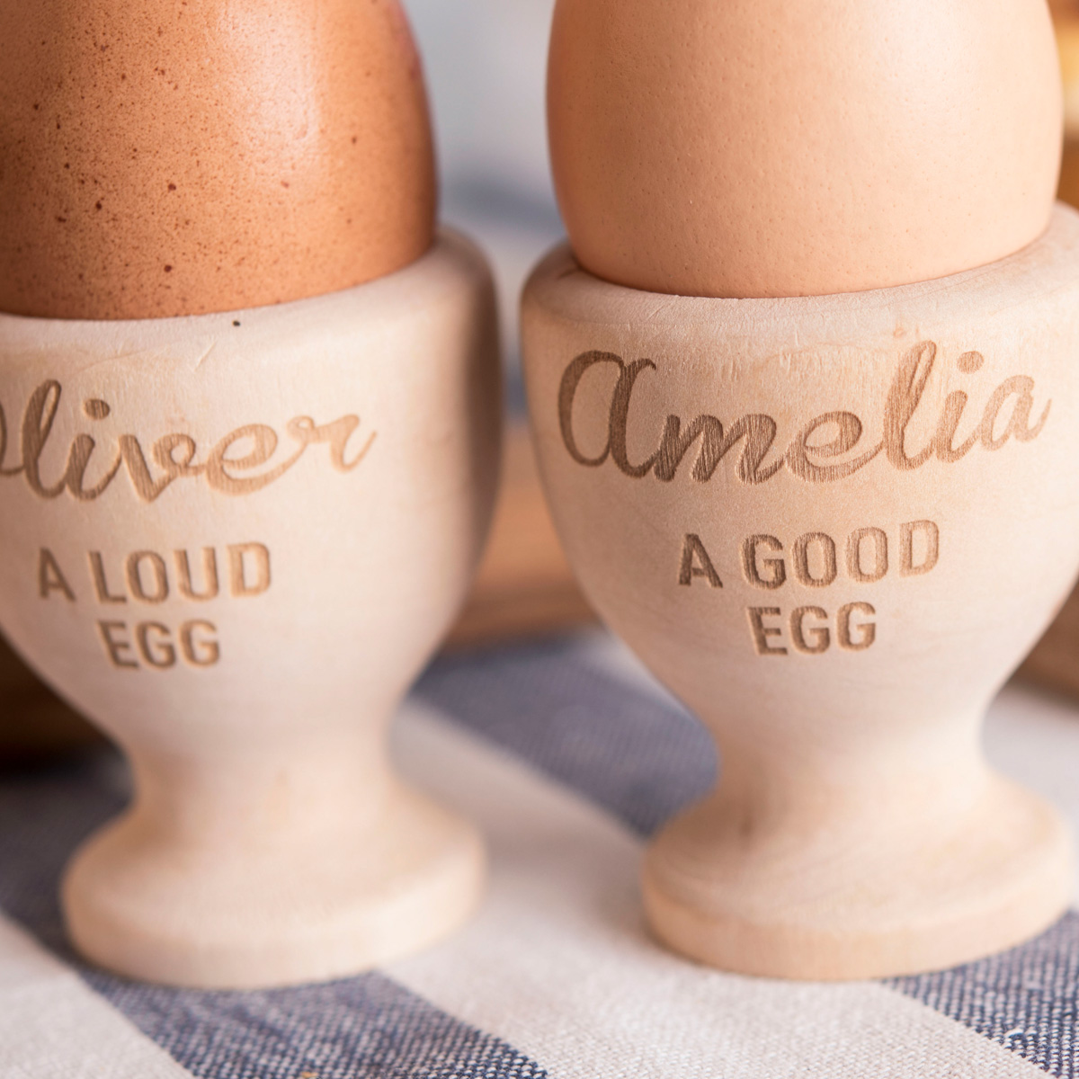 Personalised Set Of 2 Wooden Egg Cups - Good Egg, Loud Egg